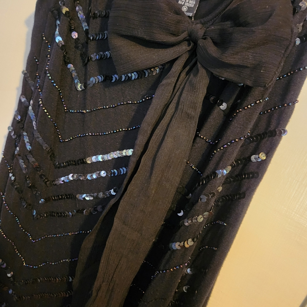 Black dress with sequins and bow detail